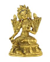 * * A Tibetan miniature gilt bronze figure of Green Tara, 18th/19th century, 3cm highProvenance: