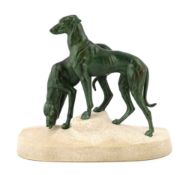 Masson, a French Art Deco spelter and composition stone group of two hounds watering, signed in