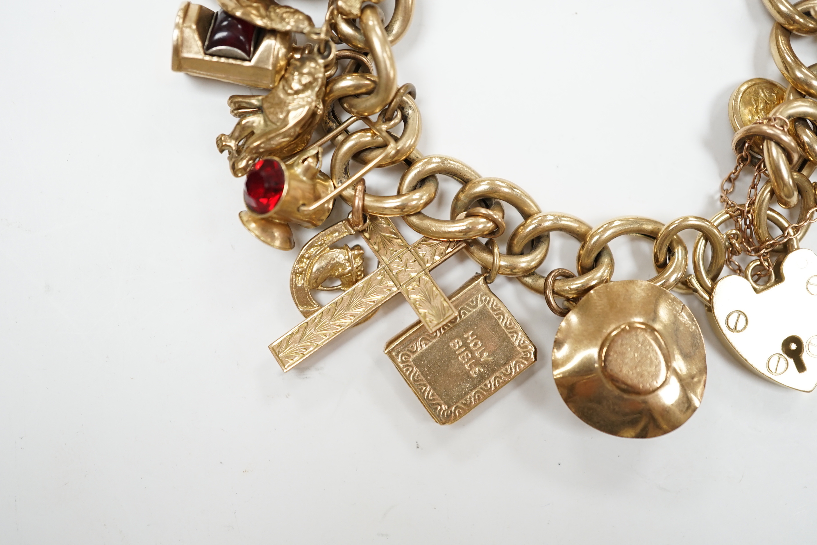 An early 1960's 9ct gold curb link charm bracelet, hung with fifteen assorted charms, including - Image 3 of 6
