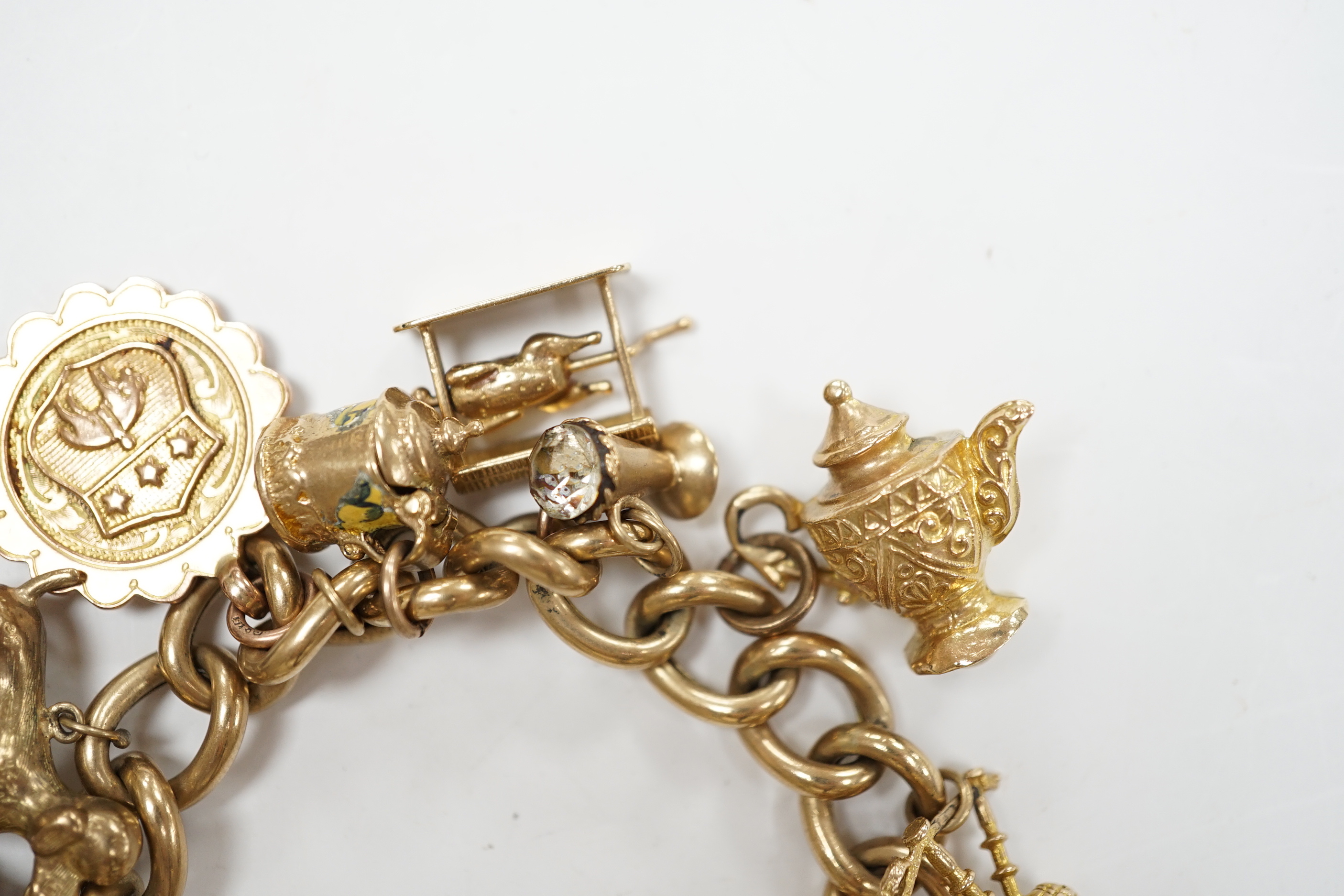 An early 1960's 9ct gold curb link charm bracelet, hung with fifteen assorted charms, including - Image 6 of 6