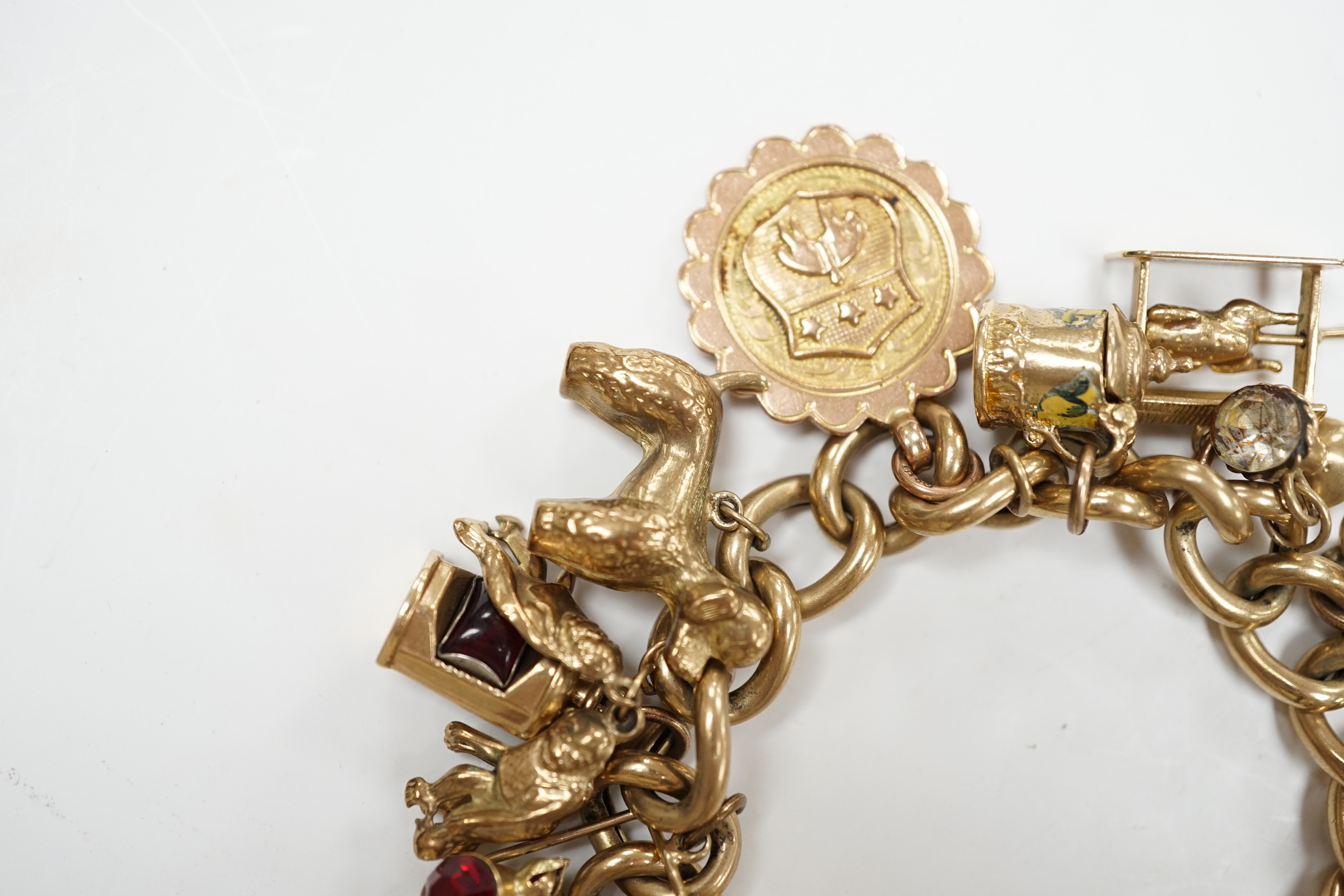 An early 1960's 9ct gold curb link charm bracelet, hung with fifteen assorted charms, including - Image 4 of 6