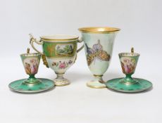 A Continental porcelain twin handled trophy cup with landscape vignettes, together with a pair of