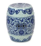 A Chinese blue and white porcelain stool, 19th century, painted with lotus flowers and scrolling