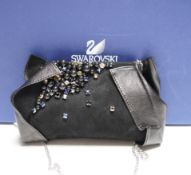 A Swarovski diamanté decorated black suede and leather evening bag, with chain handle, dust bag, box