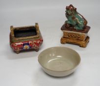 A 19th century Chinese Shiwan figure of a lion-dog, a celadon glazed shallow bowl and a cloisonné