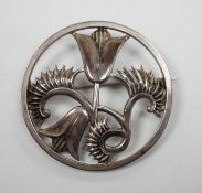 An Elizabeth II Geoffrey G. Bellamy for George Tarratt Ltd silver circular 'flower and fern' brooch,