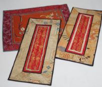 Nine Chinese silk embroidered panels, embroidered with gold thread and bordered with silk damask and