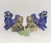 Two pairs of Chinese lion dogs; a blue and white porcelain set and a carved soapstone set,