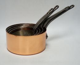 A set of five Tournus of France graduated copper saucepans
