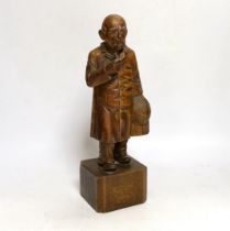 A German carved wood figure of a man, 28cm