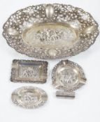 A German pierced 800 white metal oval dish, 28.4cm, three Dutch white metal ashtrays and an 835