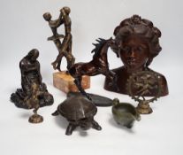 Mixed metal and carved ornaments, including a tortoise table bell, a statue of two dancers and a