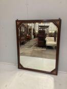 An Edwardian marquetry inlaid oak wall mirror with bevelled plate, width 108cm, height 87cm
