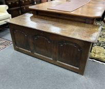 A mid 18th century oak coffer, with a triple arched fielded panelled front, width 146cm, depth 66cm,