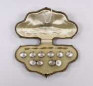 An early to mid 20th century 18ct, mother of pearl and seed pearl set eight piece dress stud set,