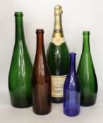 A group of five bottles including a vacant double magnum Veuve Clicquot Ponsardin bottle