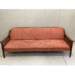 A mid century Danish design caned teak sofa bed, width 200cm, depth 75cm, height 75cm