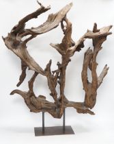 A naturalistic wood sculpture on stand, 66cm high