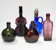 Twelve coloured glass bottles including one in the form of a violin, largest 37cm high