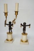 A pair of Louis XVI style bronze, ormolu and alabaster cherub lamps, 42cm high (one a.f.)