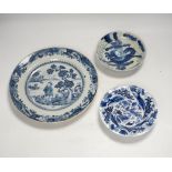 An 18th century Chinese export blue and white dish together with two others, largest 26cm