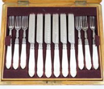 A cased set of twelve pairs of late Victorian mother of pearl handled silver dessert eaters, by