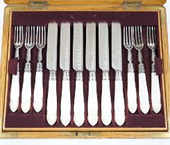 A cased set of twelve pairs of late Victorian mother of pearl handled silver dessert eaters, by