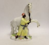 A 19th century Meissen group of a grey horse and groom, 24cm
