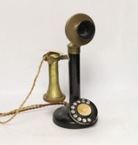 A vintage stick telephone, 32cm high
