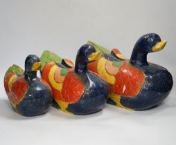 Three graduated carved and painted wood ducks, 31cm