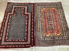 A North West Persian prayer rug, 140 x 85cm and a small red ground rug, 132 x 85cm