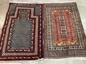 A North West Persian prayer rug, 140 x 85cm and a small red ground rug, 132 x 85cm