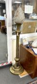 An early 20th century Indian brass floor lamp with associated opaque glass flambé shade, height