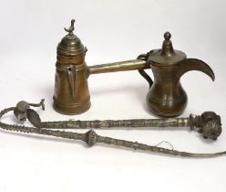 Two Indian opium pipes, and two Dallah coffee pots, tallest pot 22cm