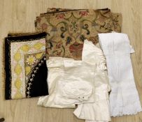 An embroidered Indian felt cover, a cream satin pageboy outfit, a white work christening gown, a