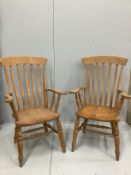 A pair of Victorian style stained beech Windsor lathe back armchairs, height 112cm