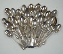 A set of eleven late Victorian silver fiddle pattern teaspoons, London, 1892 and sixteen earlier