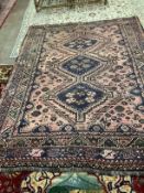 A North West Persian red ground carpet, approximately 340 x 240cm