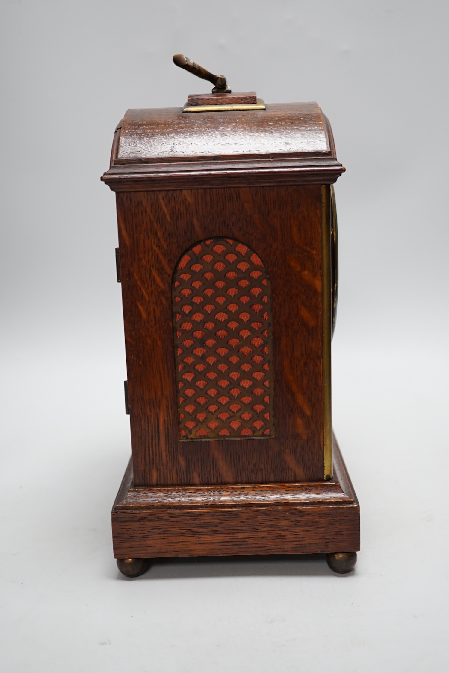 A oak mantel clock in a Regency style with pad top, striking on a coiled gong, 30cm high - Image 2 of 4
