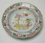 Four early 19th century ironstone dishes and a tureen together with a similar plate