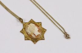 A Victorian yellow metal and seed pearl set cameo shell pendant, 40mm on a 15ct fine link chain,