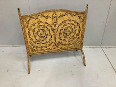 A pierced painted metal firescreen, width 80cm, height 80cm