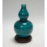 A Chinese turquoise glazed double gourd vase, on stand, 17cm