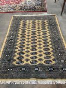 A Bokhara style cotton pile rug, 178 x 126cm