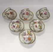 Twelve early 20th century Dresden floral tea cups and saucers
