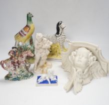 A Staffordshire spongeware rider on horseback, a Staffordshire pheasant, and three other items,