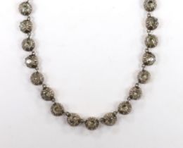 An early 19th century yellow and white metal, foil backed paste set necklace, with later 585