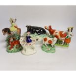 A Victorian Staffordshire cow tureen and cover, and five other Staffordshire figures, largest 18cm