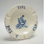 A Spanish maiolica ash tray, bearing date 1898, 21cm diameter