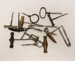A collection of 19th century and later corkscrews and two nutcrackers